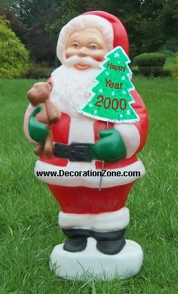 Santa with a Teddy Bear and Year 2000 Sign